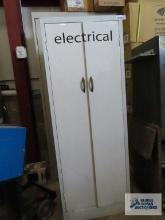 Metal two-door cabinet, approximately 5 ft tall