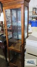Fruitwood lighted curio cabinet