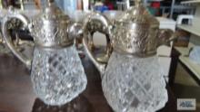 Pair of silverplate animal head top glass creamers