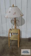 Rattan floor lamp table with formica table tops and butterfly motif shade. 54 in. tall