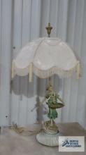 French Provincial figurine lamp. approximately 28 in. tall. Shade is 17 in. at the widest point.