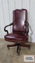 Faux leather roll about executive office chair with cherry frame