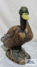 Duck ceramic figurine. 9-1/2 in. tall. Marked D inside a triangle on bottom.