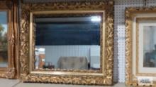 Mirror with ornate gold shadow box frame. Outside measures 36 in. by 31-1/2 in.