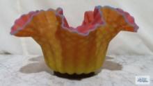 Hand blown yellow, pink and blue frilled edge bowl. approximately 6 in. tall and 11 in. wide.