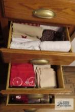 Three drawers of kitchen linens