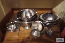 Stainless steel kitchen items including funnels, colanders, strainers, steaming baskets