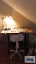 Adjustable drafting table with light, roll about chair and drafting supplies