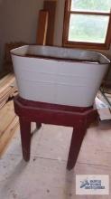 Painted metal wash tub with wooden stand