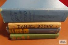 Books including Daniel Boone, The Adventures of Huckleberry Finn, Treasure Island, and Gone with the