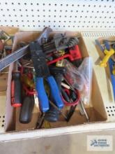 Assorted tools including Allen wrenches, wire cutters, crescent wrench, screwdrivers