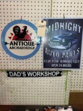 Tin Antique Archeology Sign, Tin Midnight Auto Parts Sign, and Tin Dad's Workshop Sign