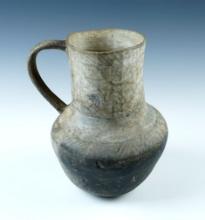 7" tall x 5" wide Anasazi black on white Handled Pitcher. Some restoration including handle.