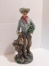 Sculpted Resin Cowboy with Saddle and Bed Roll Statue