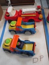 Two Fisher Price Lil' Zoomers Rockin Roll Trucks and Little Tikes Fire Truck