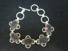 Sterling Silver Bracelet with Five Oval Purple Stones