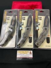 Trio of NIB Schrade model SG8RMCP Folding Knives, 2 are still sealed in packaging, w/ nylon sheaths