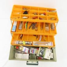 Vintage tackle box with fishing lures and gear