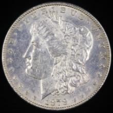 1878 7 tail feather, reverse of 1879 U.S. Morgan silver dollar