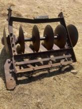 Vintage bottom plow, used as yard art