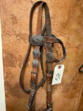 Vintage leather bridle decorated with Eagle dollar coins.