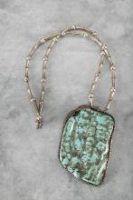 Large Necklace with Naja mounted with large turquoise stone that measures 3" across x 5" L. Unusual