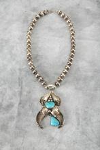 Beautiful Turquoise, Sterling and Bear Claw Necklace with Naja measuring 3 1/2" long with sterling d
