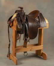 Early square skirt Saddle with loop seat and Samstag Rigging, made by Wyeth, St. Joseph, Mo., has ir