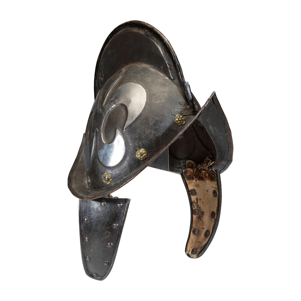 A German Black and White Comb Morian Helmet with Ear Flaps