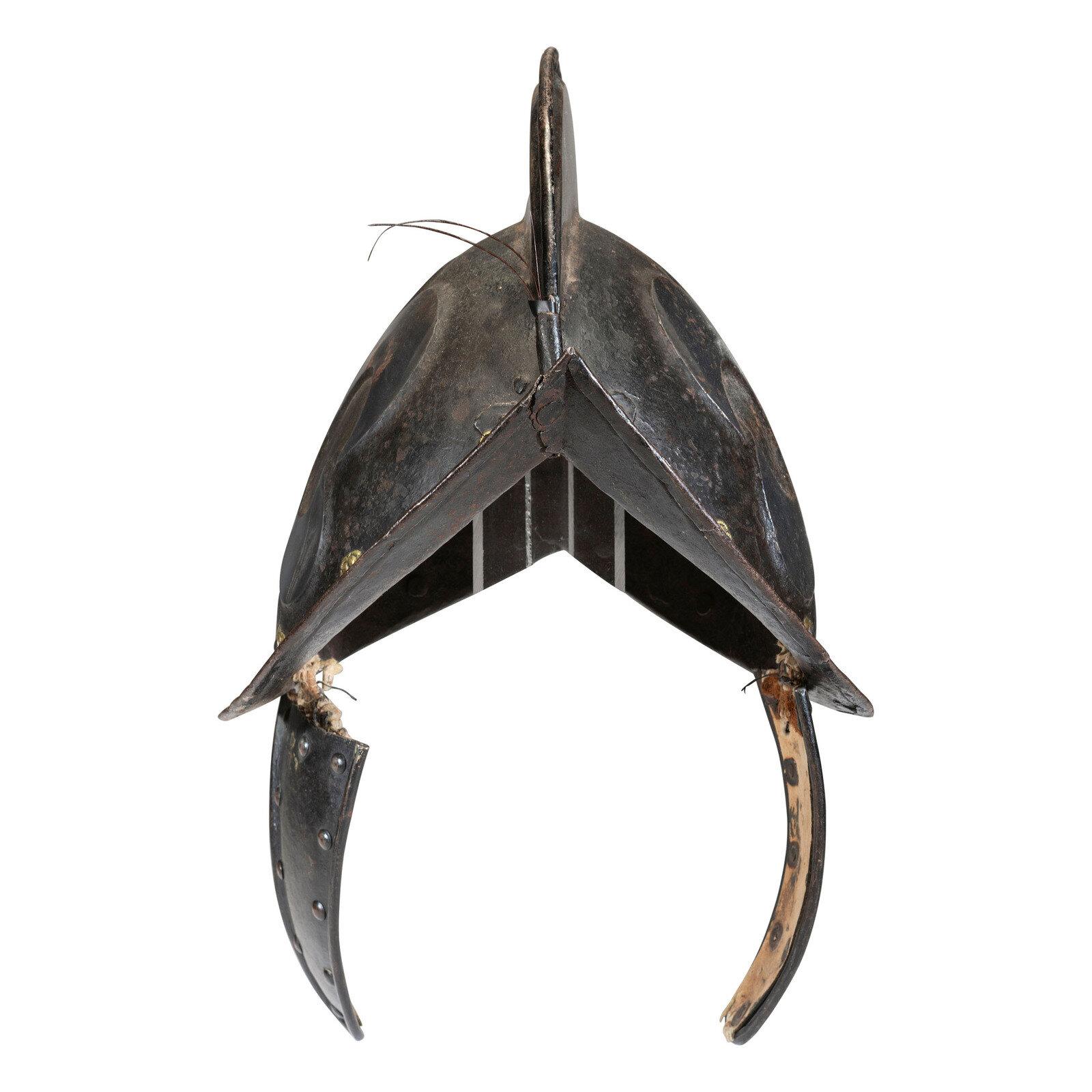 A German Black and White Comb Morian Helmet with Ear Flaps