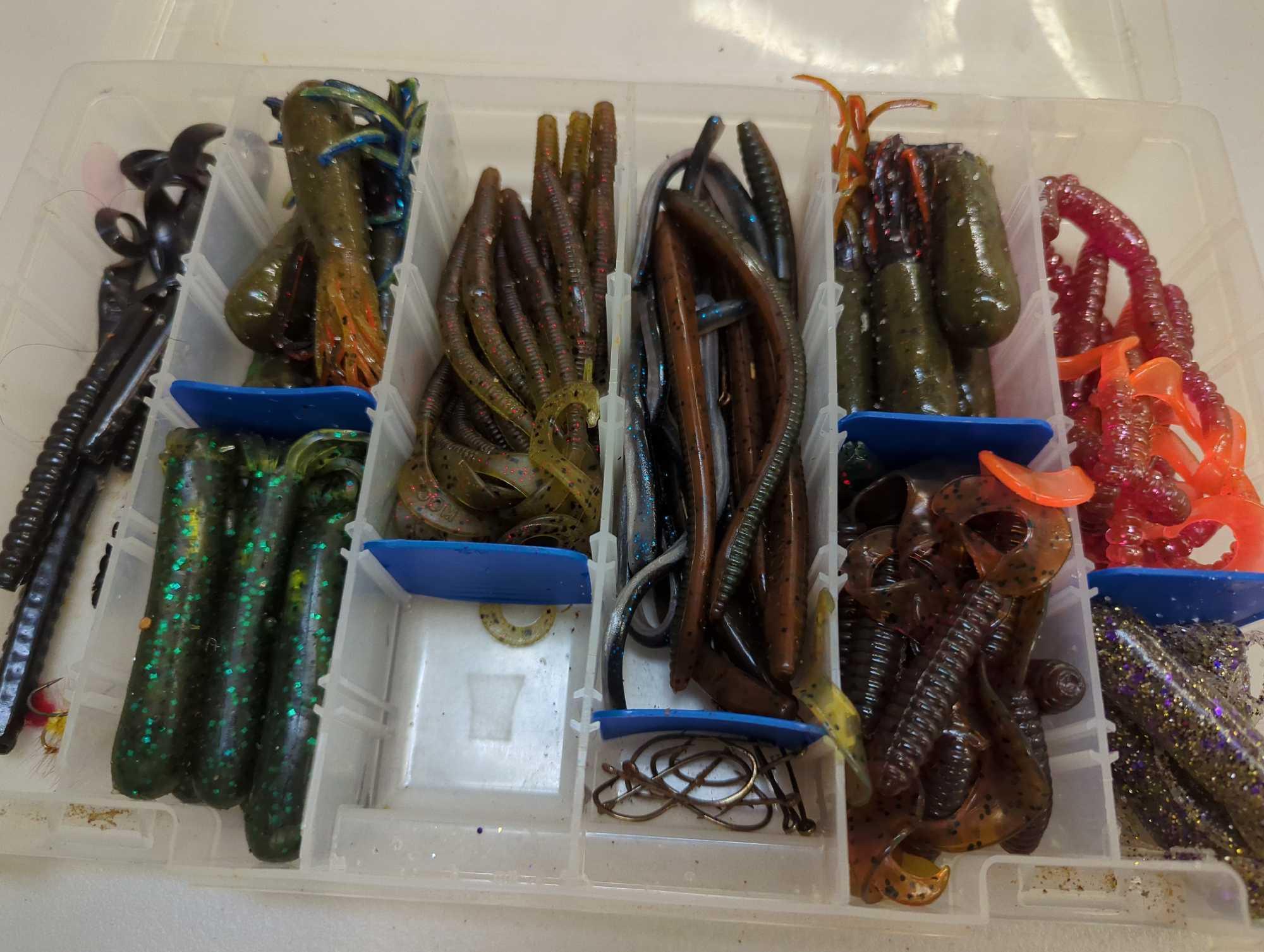 Tackle Box and contents including various fishing worms of similar style. Comes as is shown in