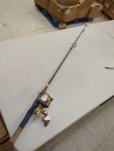 Brown 5'8" fishing rod with spinning reel. Comes as a shown in photos. Appears to be used.