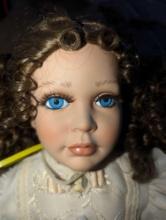 (GAR) 1980's Southern Belle Porcelain Doll with Brown Hair and Blue Eyes Wearing a White Ruffled