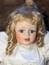(GAR) Blonde Haired and Blue Eyed Porcelain Doll Wearing a White Wedding Dress with Lace Overlay,