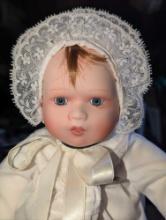 (GAR) Red Haired and Blue Eyed Porcelain Baby Doll Wearing a White Dress Matching Bonnet,