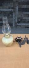 CAST IRON SWING ARM WALL SCONCE & POTTERY OIL LAMP