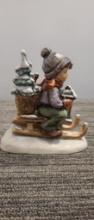 M.I. HUMMEL FIGURINE "RIDE INTO CHRISTMAS"