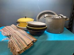 Large lot of granite ware and enamel ware and a rag rug