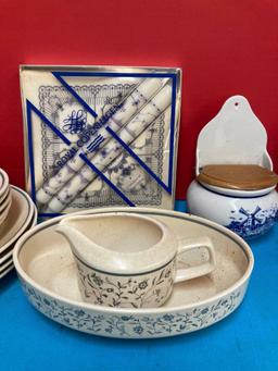 Partial temperware dishes, royal Copenhagen candles and napkins, blue Delft, and two cubist glasses