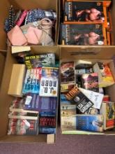 two boxes of paperback books