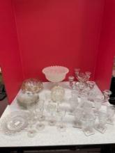 Crystal candleholders, etched Sherry glasses, other clear glassware, and a frosted compote