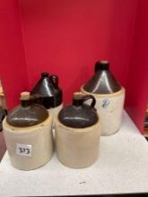 Very nice lot of four antique crock jugs