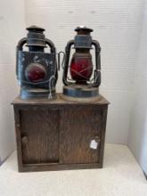Vintage wood cabinet and two Dietz lanterns one has a broken globe