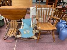 Vintage oak chair, a baby cradle, a baby horse toy, and a vintage child?s sled