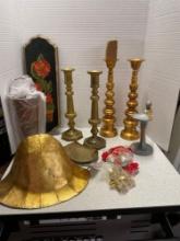 Brass candlesticks, brass knobs, and other home decor