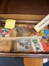 Old toys, marbles puzzle, harmonica, kaleidoscope, watch, fake, canine, fecal matter, etc.