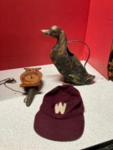 Metal duck watering can, German owl cuckoo clock, old baseball cap with W.