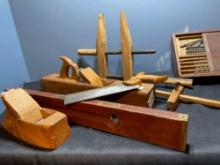 antique woodworking tools including planers, clamp, level and more