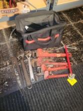 Tool bag of 14 and 10 inch pipe wrenches and cresent wrenches