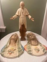 Religious statues, plaster wall hangings